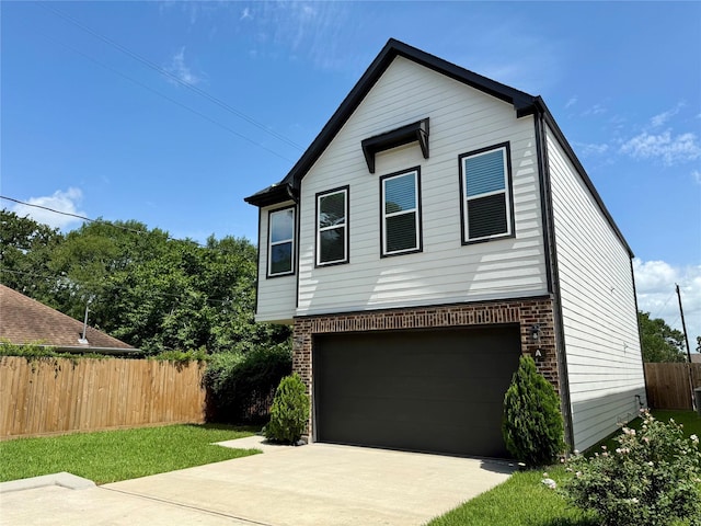 6635 Tc Jester Blvd Unit A, Houston, TX 77007 - view of front facade with brick siding, a garage, and concrete driveway