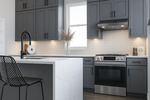 811 Thornton Rd Unit B, Houston, TX 77018 - kitchen with stainless steel range oven, custom range hood, light countertops, gray cabinetry, and dark wood-style floors
