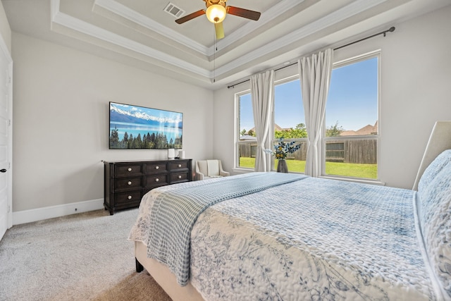 16715 Bark Cabin Dr, Humble, TX 77346 - carpeted bedroom featuring a raised ceiling, ornamental molding, and ceiling fan
