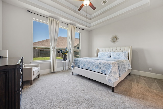 16715 Bark Cabin Dr, Humble, TX 77346 - carpeted bedroom featuring a tray ceiling, crown molding, and ceiling fan