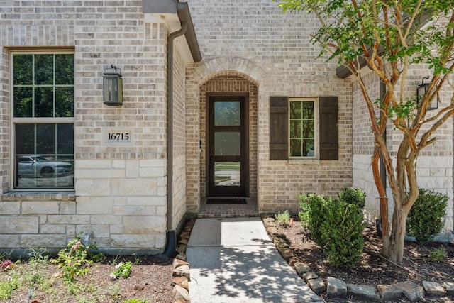 16715 Bark Cabin Dr, Humble, TX 77346 - view of exterior entry with brick siding and stone siding