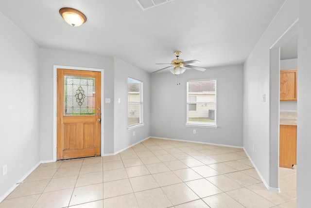 9311 Norwood Trails Dr, Humble, TX 77396 - foyer entrance with a ceiling fan and light tile patterned flooring