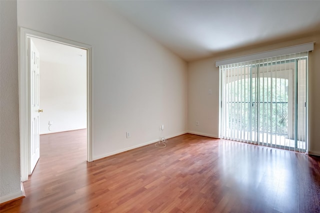 3231 Allen Pkwy Unit 1306, Houston, TX 77019 - empty room with wood finished floors and vaulted ceiling