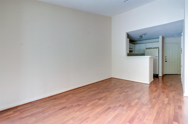 3231 Allen Pkwy Unit 1306, Houston, TX 77019 - unfurnished living room with light wood-style floors and baseboards