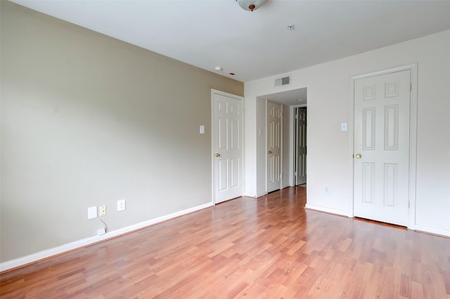 3231 Allen Pkwy Unit 1306, Houston, TX 77019 - unfurnished bedroom with light wood-style floors and baseboards