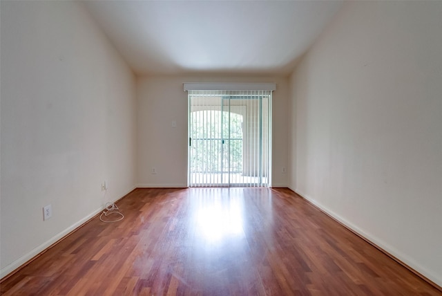 3231 Allen Pkwy Unit 1306, Houston, TX 77019 - spare room featuring wood finished floors and vaulted ceiling