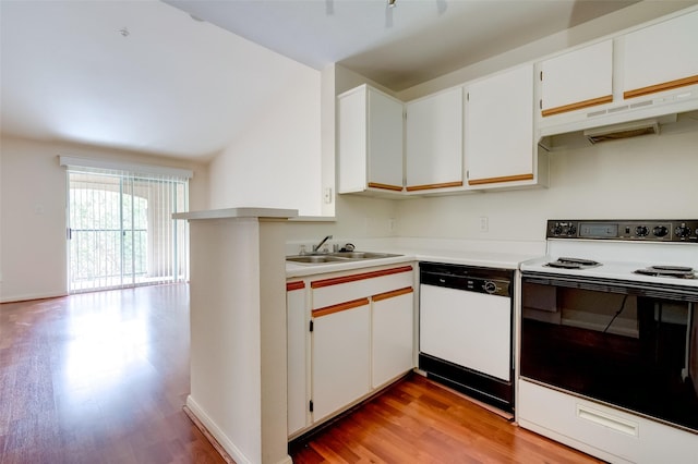 3231 Allen Pkwy Unit 1306, Houston, TX 77019 - kitchen with white appliances, under cabinet range hood, light wood-style floors, light countertops, and white cabinetry