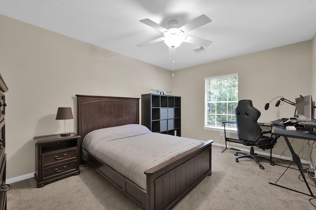35 S Floral Leaf Cir, The Woodlands, TX 77381 - bedroom featuring light colored carpet, an office area, and a ceiling fan