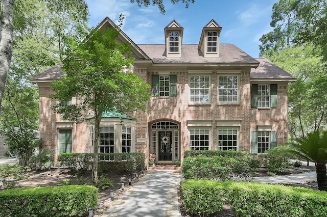 35 S Floral Leaf Cir, The Woodlands, TX 77381 - view of front of home featuring brick siding and a shingled roof