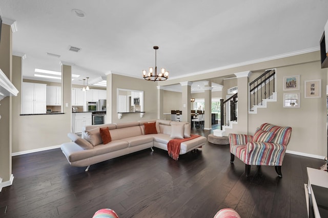 35 S Floral Leaf Cir, The Woodlands, TX 77381 - living room featuring a chandelier, dark wood-type flooring, and crown molding