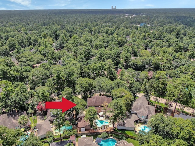 35 S Floral Leaf Cir, The Woodlands, TX 77381 - aerial view of property's location featuring a forest and a pool area