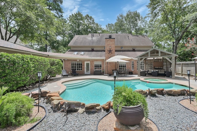 35 S Floral Leaf Cir, The Woodlands, TX 77381 - view of swimming pool featuring an outdoor living space, a patio, a gazebo, and a pool with connected hot tub