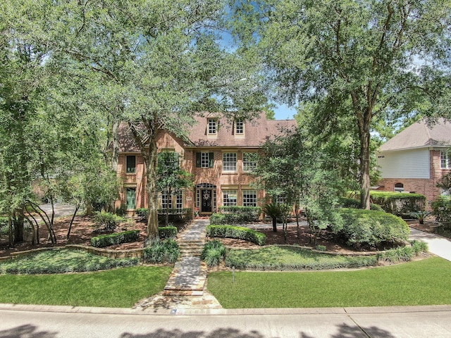 35 S Floral Leaf Cir, The Woodlands, TX 77381 - view of front of home with a front yard
