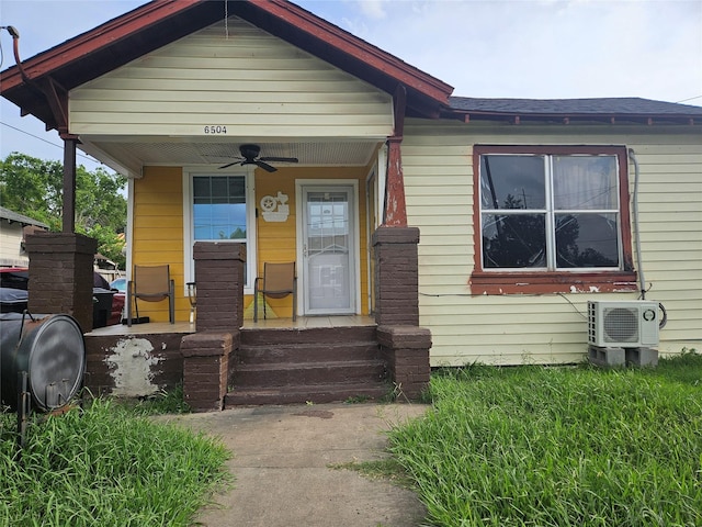 6504 Ave J, Houston, TX 77011 - view of front of home featuring covered porch, ceiling fan, and heating fuel