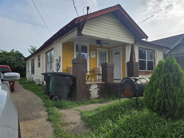 6504 Ave J, Houston, TX 77011 - view of front of house with ceiling fan, a porch, and oil tank