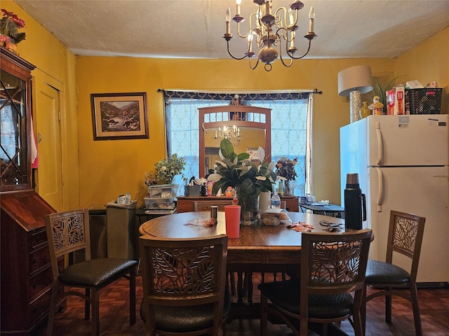 6504 Ave J, Houston, TX 77011 - dining room with a chandelier and a textured ceiling