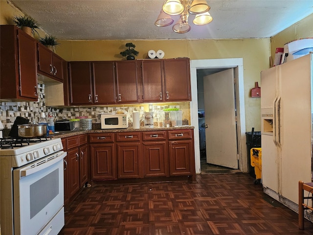 6504 Ave J, Houston, TX 77011 - kitchen with white appliances, a chandelier, a textured ceiling, and backsplash