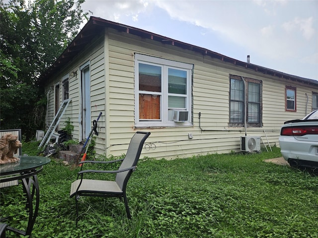 6504 Ave J, Houston, TX 77011 - view of property exterior featuring a yard and cooling unit