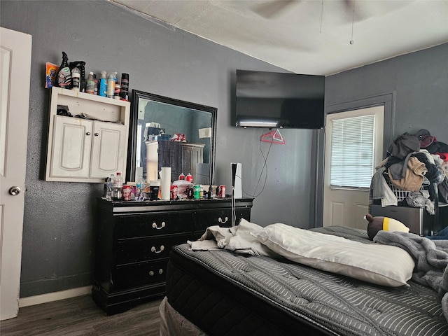 6504 Ave J, Houston, TX 77011 - bedroom featuring dark wood finished floors and baseboards