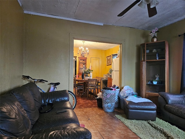 6504 Ave J, Houston, TX 77011 - living area with a ceiling fan, a chandelier, and a textured ceiling