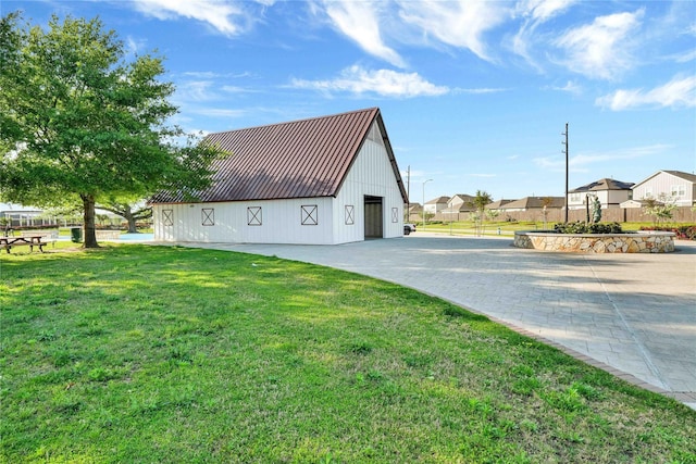 23823 Escardilla Ln, Hockley, TX 77447 - view of side of property with a metal roof, an outbuilding, a residential view, and a standing seam roof