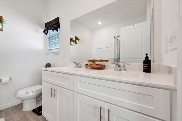 23823 Escardilla Ln, Hockley, TX 77447 - bathroom featuring double vanity and wood finished floors