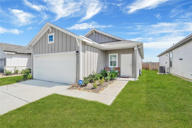 23823 Escardilla Ln, Hockley, TX 77447 - view of front of property featuring board and batten siding, a garage, and driveway