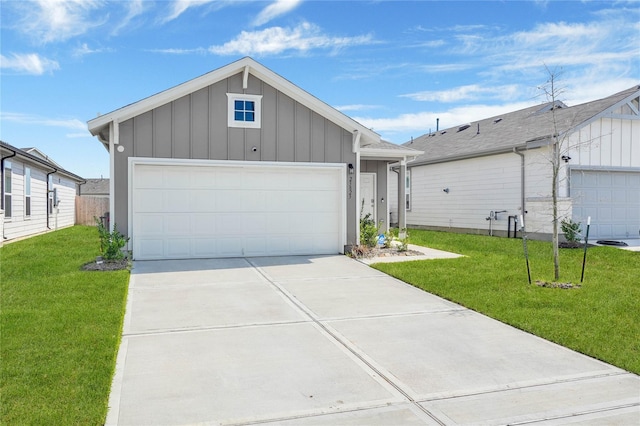23823 Escardilla Ln, Hockley, TX 77447 - view of front facade featuring board and batten siding, a front yard, and driveway