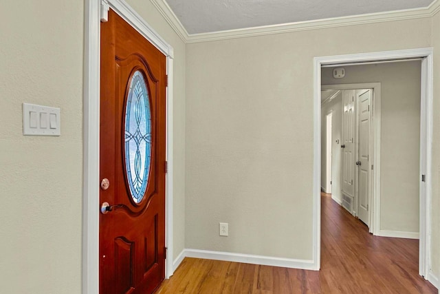 925 Royal Oak Dr, Dickinson, TX 77539 - entryway with ornamental molding and wood finished floors