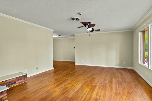 925 Royal Oak Dr, Dickinson, TX 77539 - spare room with a ceiling fan, wood finished floors, ornamental molding, and a textured ceiling