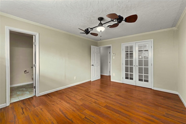 925 Royal Oak Dr, Dickinson, TX 77539 - unfurnished bedroom featuring wood finished floors, french doors, a textured ceiling, crown molding, and a ceiling fan