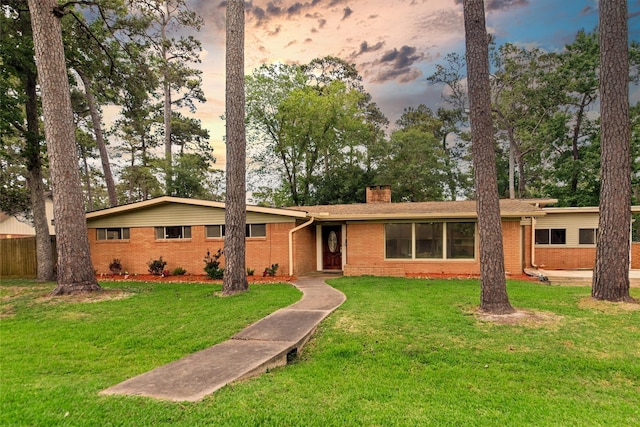 925 Royal Oak Dr, Dickinson, TX 77539 - single story home with brick siding, a chimney, and a lawn
