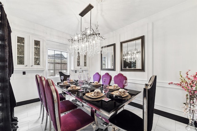 14907 Alderwick Dr, Sugar Land, TX 77498 - dining room with a chandelier and marble finish flooring