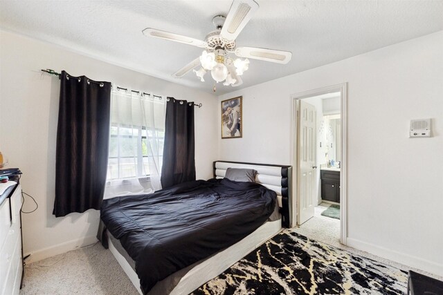 14907 Alderwick Dr, Sugar Land, TX 77498 - bedroom with carpet floors, ensuite bathroom, and ceiling fan
