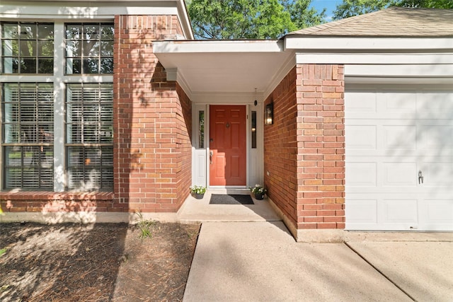 3 Whistlers Walk Pl, The Woodlands, TX 77381 - entrance to property featuring brick siding, a garage, and a shingled roof