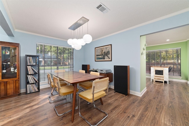 3 Whistlers Walk Pl, The Woodlands, TX 77381 - dining space featuring ornamental molding, wood finished floors, and a chandelier