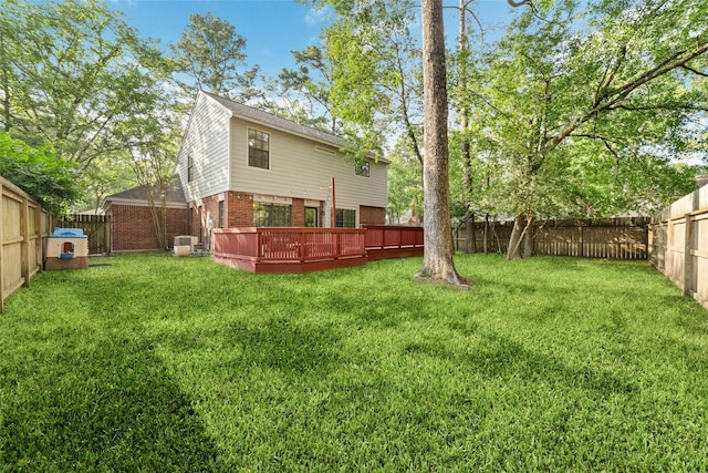 3 Whistlers Walk Pl, The Woodlands, TX 77381 - rear view of house with brick siding, a fenced backyard, and a wooden deck
