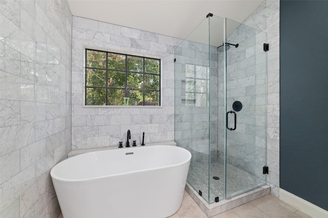 3 Whistlers Walk Pl, The Woodlands, TX 77381 - full bathroom featuring a freestanding bath, a stall shower, tile patterned flooring, and tile walls
