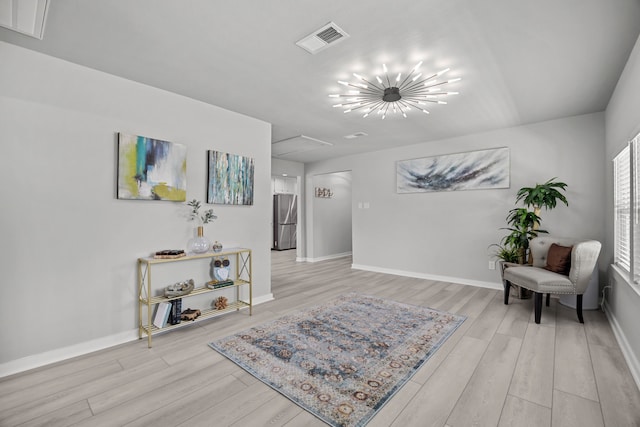 5709 David St, Dickinson, TX 77539 - living area with light wood finished floors, attic access, and a chandelier