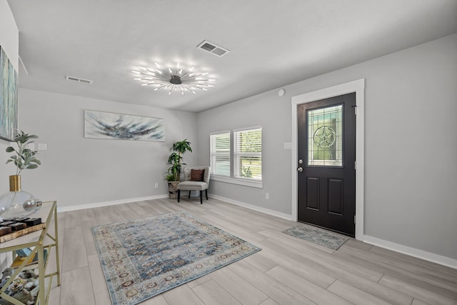 5709 David St, Dickinson, TX 77539 - entrance foyer with wood finished floors and a chandelier