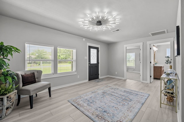 5709 David St, Dickinson, TX 77539 - entrance foyer featuring a chandelier and light wood finished floors