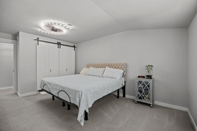 5709 David St, Dickinson, TX 77539 - bedroom featuring light carpet, a barn door, and vaulted ceiling