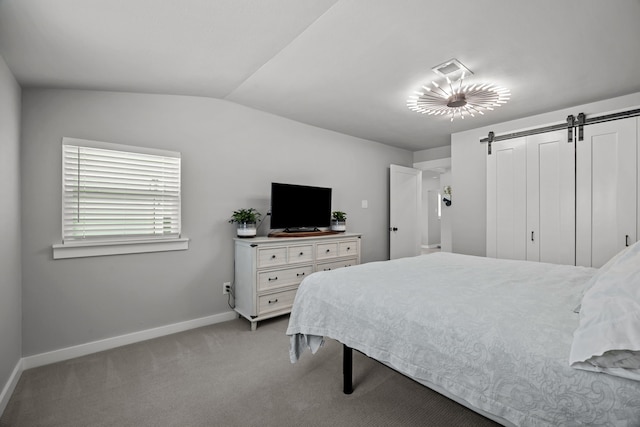 5709 David St, Dickinson, TX 77539 - bedroom with a barn door, light carpet, and lofted ceiling