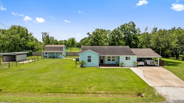 5709 David St, Dickinson, TX 77539 - view of front of home with driveway, view of scattered trees, and an attached carport