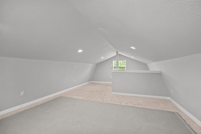 5709 David St, Dickinson, TX 77539 - bonus room with lofted ceiling, carpet, recessed lighting, and a textured ceiling