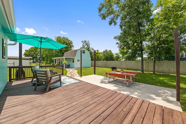 5709 David St, Dickinson, TX 77539 - wooden deck with a fenced backyard, an outdoor structure, and a patio