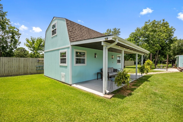 5709 David St, Dickinson, TX 77539 - back of house featuring roof with shingles and a patio area