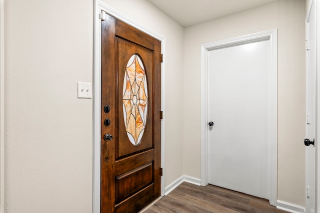 12135 Quail Creek Dr, Houston, TX 77070 - foyer entrance with dark wood-style floors and baseboards