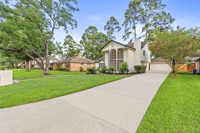 12135 Quail Creek Dr, Houston, TX 77070 - view of front facade featuring a garage, driveway, and a front lawn