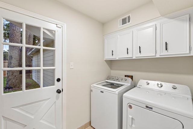 12135 Quail Creek Dr, Houston, TX 77070 - laundry area with cabinet space and washer and clothes dryer